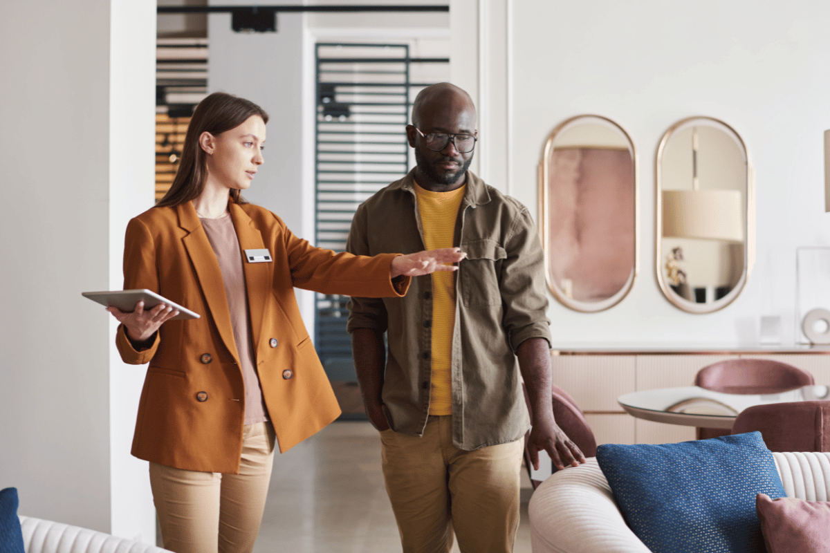 A saleswoman with a customer in a furniture store