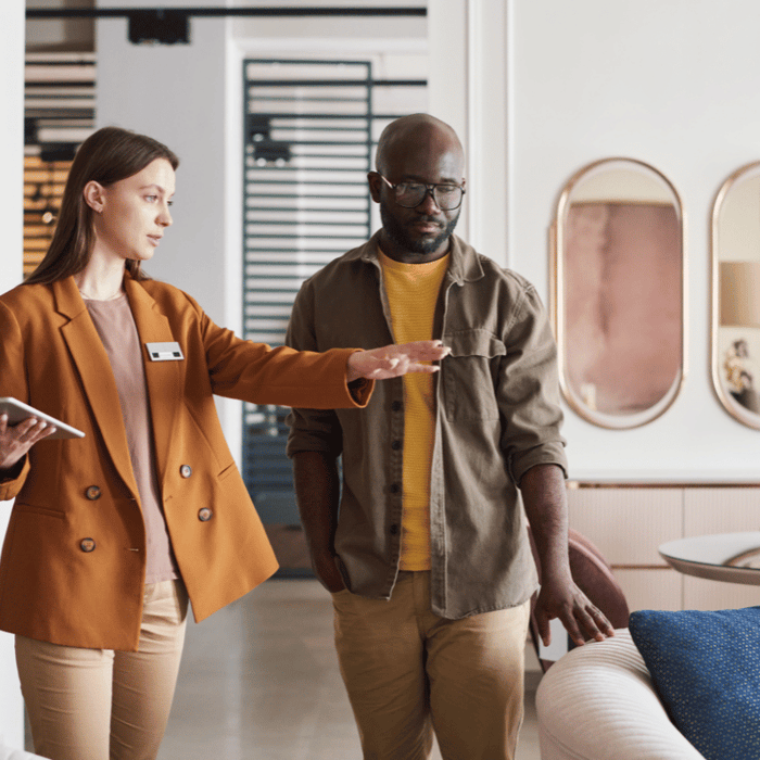 A saleswoman with a customer in a furniture store